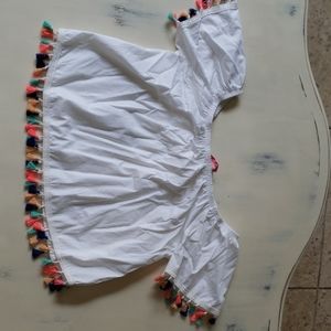 White off the shoulder top with colorful tassels